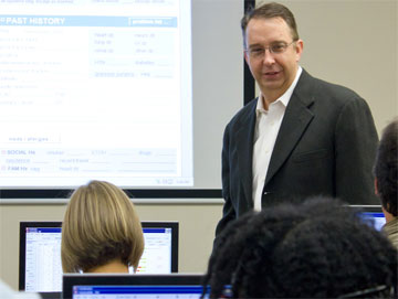Dr. Robert Hitchcock Dr. Robert Hitchcock conducts a training session with ED staff.